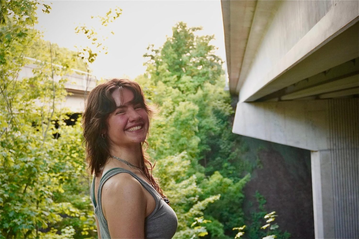 Megan outdoors among greenery